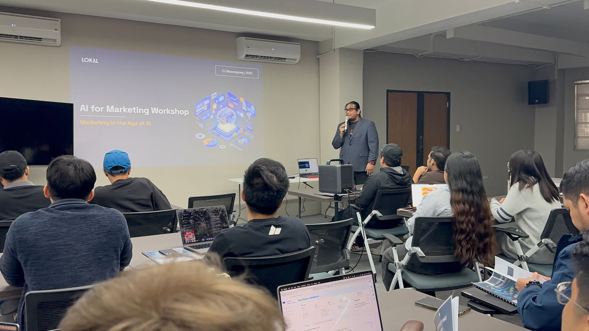 CJ Masungsong leading a LOKAL AI for Marketing workshop to a full room
